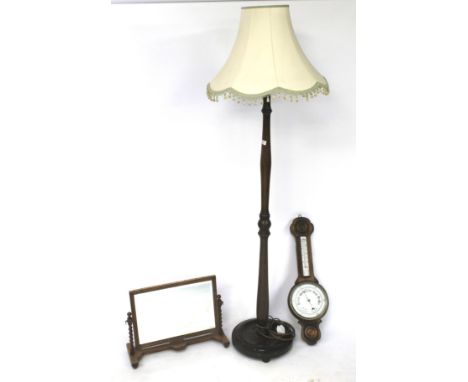 A standard lamp, mirror and a barometer. The first a turned mahogany standard lamp with cream coloured shade, the second an o