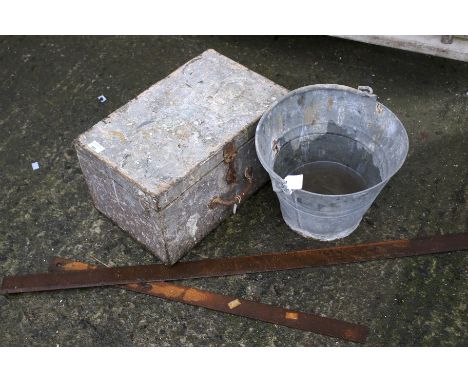A galvanized bucket box of vintage tools and brushes and a pair of rulers. 