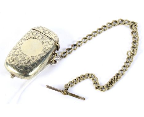 A Victorian white metal sovereign case, vesta and Albert chain. The sovereign case and vesta with engraved decoration, 68.4g 