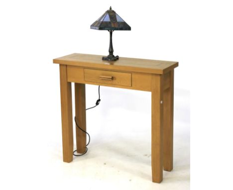 A Morris Furniture contemporary light oak console table with a single drawer and a lamp. The table L90cm x D30cm x H85cm, the