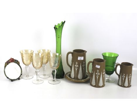 A collection of assorted glassware and ceramics. A set of three graduated brown stoneware jugs with fern and blue applied dec