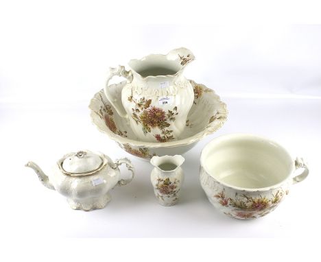 A Victorian water jug and bowl wash set with matching pot and vase. With a similar boat shape teapot. The bowl Diam 44cm 