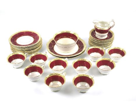 A Jackson and Gosling part tea service and sandwich set. Including plates, cups and saucers, a cream jug and a sugar bowl, de