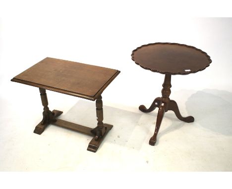 A contemporary mahogany effect pie crust tripod table. Diam 60cm, H68cm 