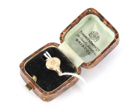 An early 20th century 9ct rose gold signet ring. Hallmarks for Chester 1928, size K, 2.6g; in a vintage paper box marked 'Ple