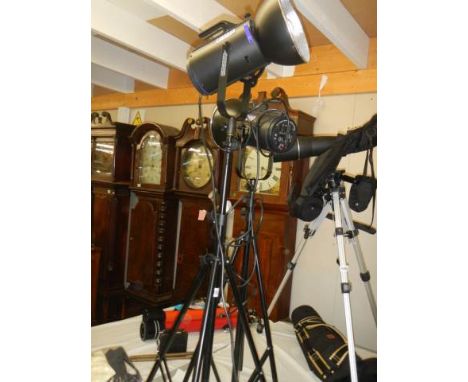 A pair of new Courtnay 300s studio lights with light deflectors, stands, cases etc., COLLECT ONLY.