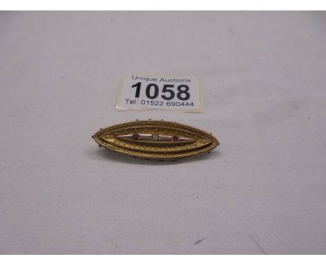 A 19th century diamond/ruby brooch stamped Chester 1897, 9ct gold.