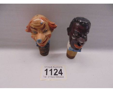 Two vintage novelty porcelain head bottle stoppers.