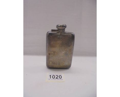 A hall marked silver hip flask.Sheffield 1914 William Hutton & sons, various Small pocket dents, lid shuts snuggly, will like