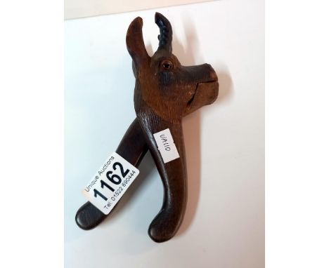 An unusual wooden deer head nut cracker
