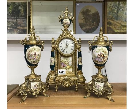 A Brass clock set with Porcelain  columns and panels, Quartz movementNo visible cracks or damage