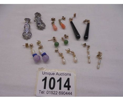 Six pair of 9ct gold earrings (coral/pearl etc.,) and a pair of marcasite earrings.