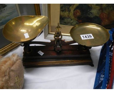 A set of old brass kitchen scales.