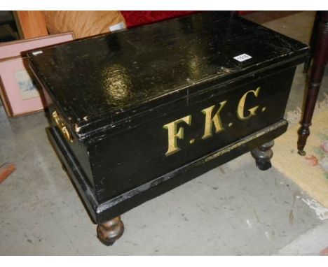 A painted pine tool box on wheels marked 'FKG' with brass handles 44 55 x 35 cm. COLLECT ONLY.
