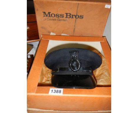 A vintage chauffeurs cap in a Moss Bros box with original bill of sale.