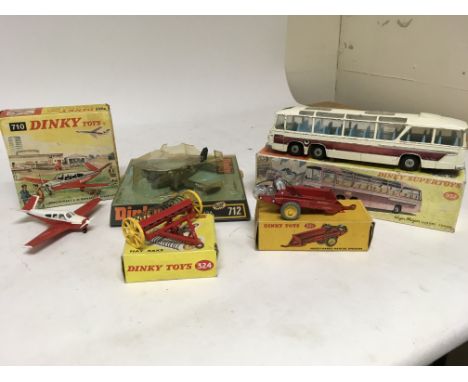 A collection of boxed Dinky toys including , Beechcraft s35 bonanza aircraft, US Army T42A no712, Vega major luxury coach no 