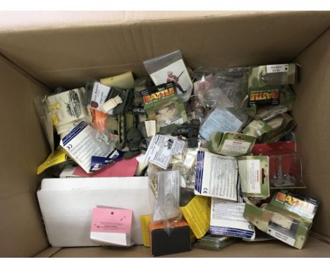 A large collection of white metal models and 1/100 scale model tanks etc