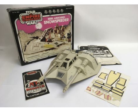 A boxed vintage Star Wars Snowspeeder by Palitoy with instructions, original used transfer sheet and a Bounty Hunter capture 