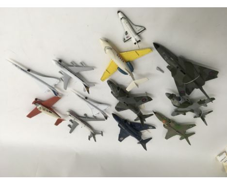 A collection of 11 unboxed model aircraft including 7 Dimky toys to include 2 Harriers, Phantom, MCRA, Jaguar, etc