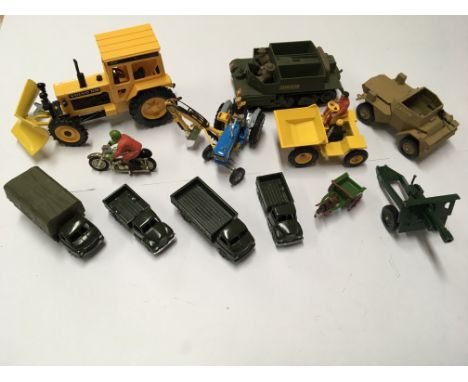 A collection of unboxed Britain’s model vehicles including military and farming