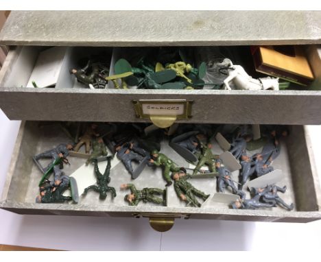 A 4 drawer unit containing a collection of unboxed model soldiers and others