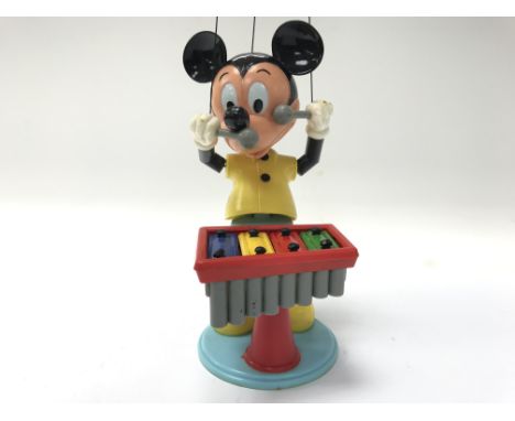 A Mickey Mouse xylophone puppet with glove.