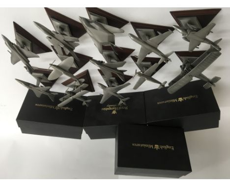 A collection of 4 boxed and 12 unboxed English minitures pewter model aircraft