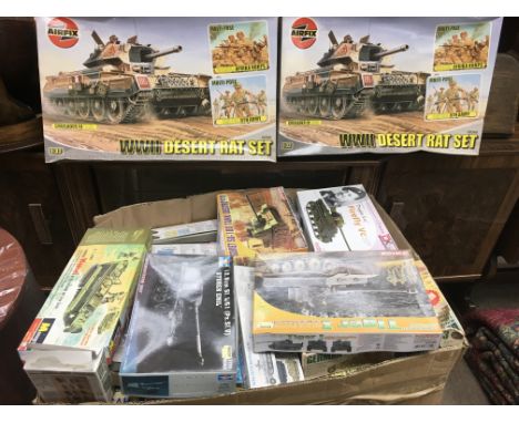 A large box of plastic model kits depicting military vehicles , Tanks , Armoured cars  etc