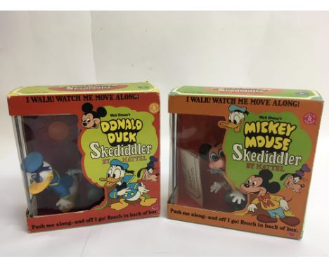 Two boxed and unopened  vintage Disney Skediddler figures, Mickey Mouse and  Donald Duck, with ' push and go' and talking act