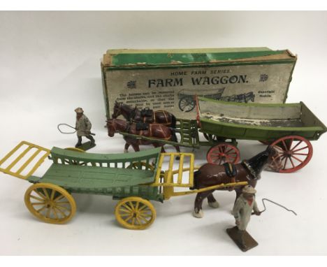 A boxed Britain’s F5 farm wagon with drover together with an unboxed Charbens farm wagon and drover