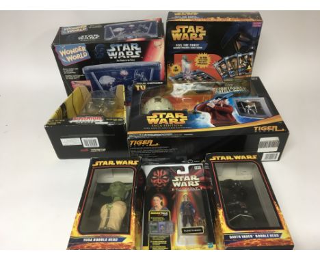 A collection of modern Star wars toys including power of the force , 2 bobble head figures, wonder world, Light saber battle 