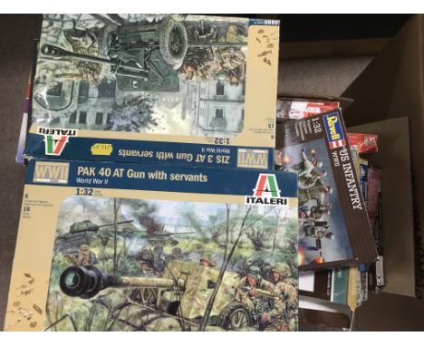 A collection of plastic model kits including Airfix, depicting Military personnel