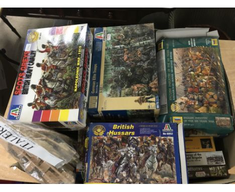 A large collection of boxed plastic model kits 1/72 and 1/32 military and historical figures
