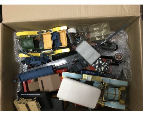 A large collection of made up model kits all loose