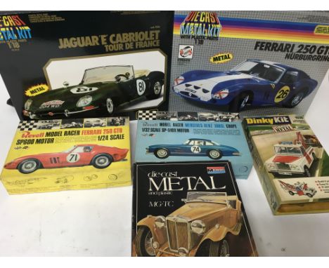 A collection of boxed diecast model kits