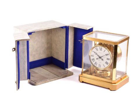 A Jaeger LeCoultre "Atmos" mantle timepiece (Number 197679) housed in its official presentation travel case, 21 cm wide x 12 