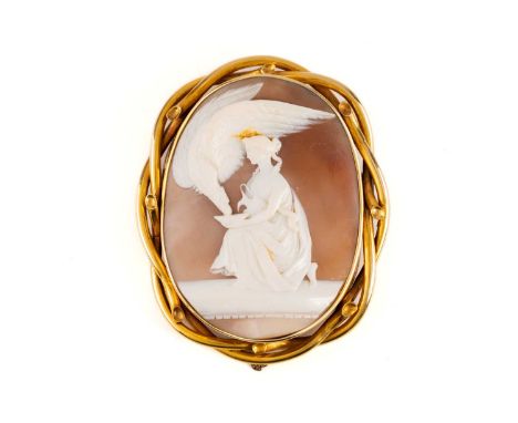A large Victorian shell cameo brooch, depicting a Classical scene of Hebe feeding the Eagle of Zeus, framed within a twisted 