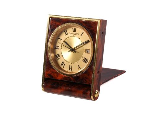 A Jaeger-LeCoultre Travel Alarm clock, featuring a hand-wound Swiss-made mechanical alarm feature movement in a brass case wi