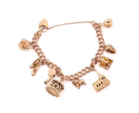 A 9ct gold charm bracelet with nine assorted charms, consisting of a double curb link chain, suspending with a collection of 