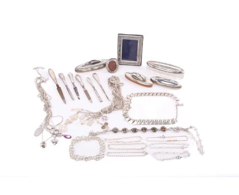 A mixed collection comprising three silver-mounted nail buffs, six silver-mounted manicure tools, an oval cut glass box with 