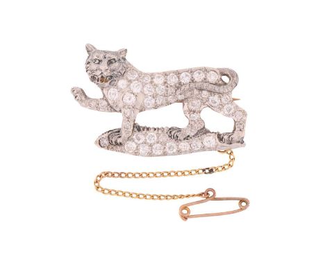 A tiger passant diamond brooch, the walking feline has been fully encrusted with old-cut diamonds in various sizes, fitted wi