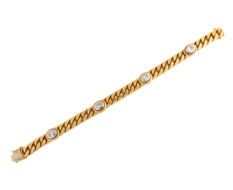 A diamond-set curb link bracelet, featuring a heavy curb link chain with four intervals, set with oval-cut diamonds with an a