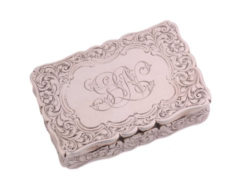 A Victorian silver snuff box of shaped rectangular form allover decorated with scrolling flowering foliage with a central C s