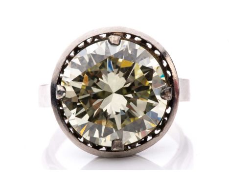A diamond solitaire ring, featuring a light yellow round brilliant-cut diamond of 8.62ct, mounted in a claw setting, under ga