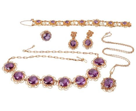 A synthetic colour-changing sapphire parure including a necklace, a pendant on chain, a bracelet, a pair of earrings, and a r