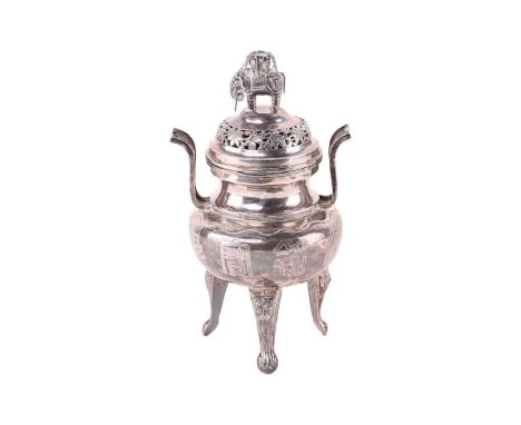 A Chinese silver censer, Qing, 19th century, the cover with an elephant supporting an urn of leaves above a pierced floiate b