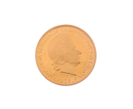 An 18ct gold 'The Magic Flute' medal coin, featuring a profile of the composer Wolfgang Amadeus Mozart on the observe, Tamino