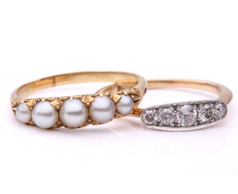 A pearl half-hoop ring and a diamond half-hoop ring; the first comprises five graduated grey pearls, in engraved scrollwork m
