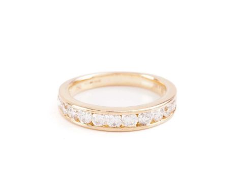 A diamond half-eternity ring in 18ct yellow gold, channel-set with thirteen graduated brilliant-cut diamonds, to a tapering f