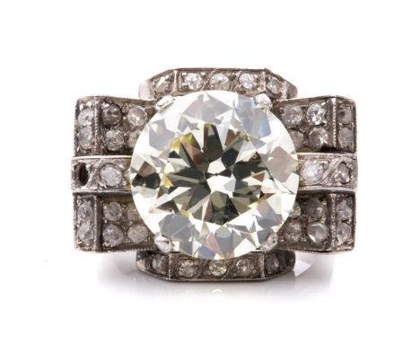 An Art Deco style diamond cocktail ring, scintillating with a light yellow round brilliant-cut diamond of 8.81ct, claw-set in